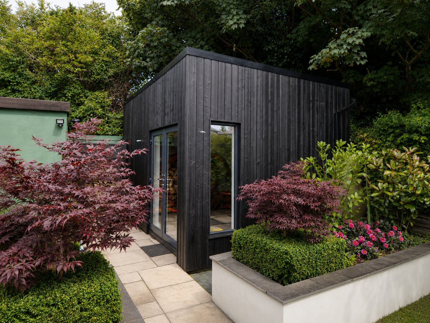 Garden room surrounded by landscaping Dublin