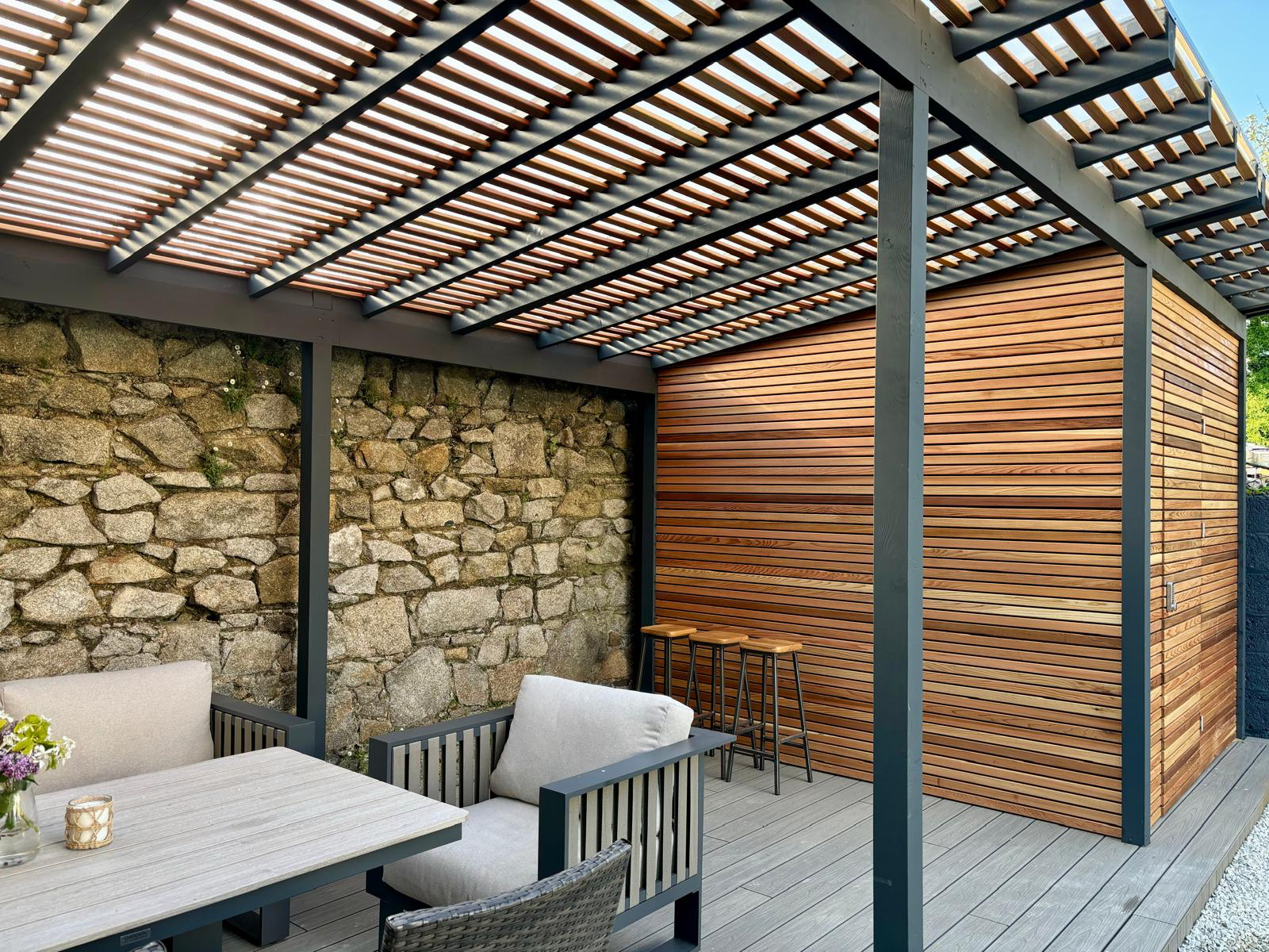 Steel louvred pergola with cedar screening and composite decking Dublin